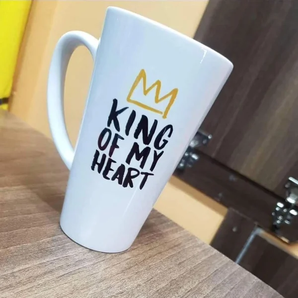 Conical white latte mug printed "King of my Heart" with a gold crown