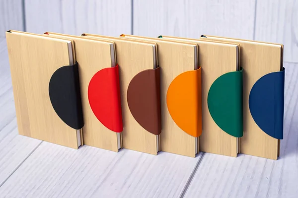 Bamboo cover notebooks with rounded coloured flaps in six colours