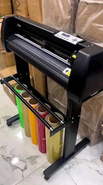 Cutting plotter on stand with vinyl rolls