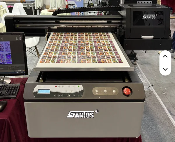 UV flatbed printer with a printed sheet on the bed